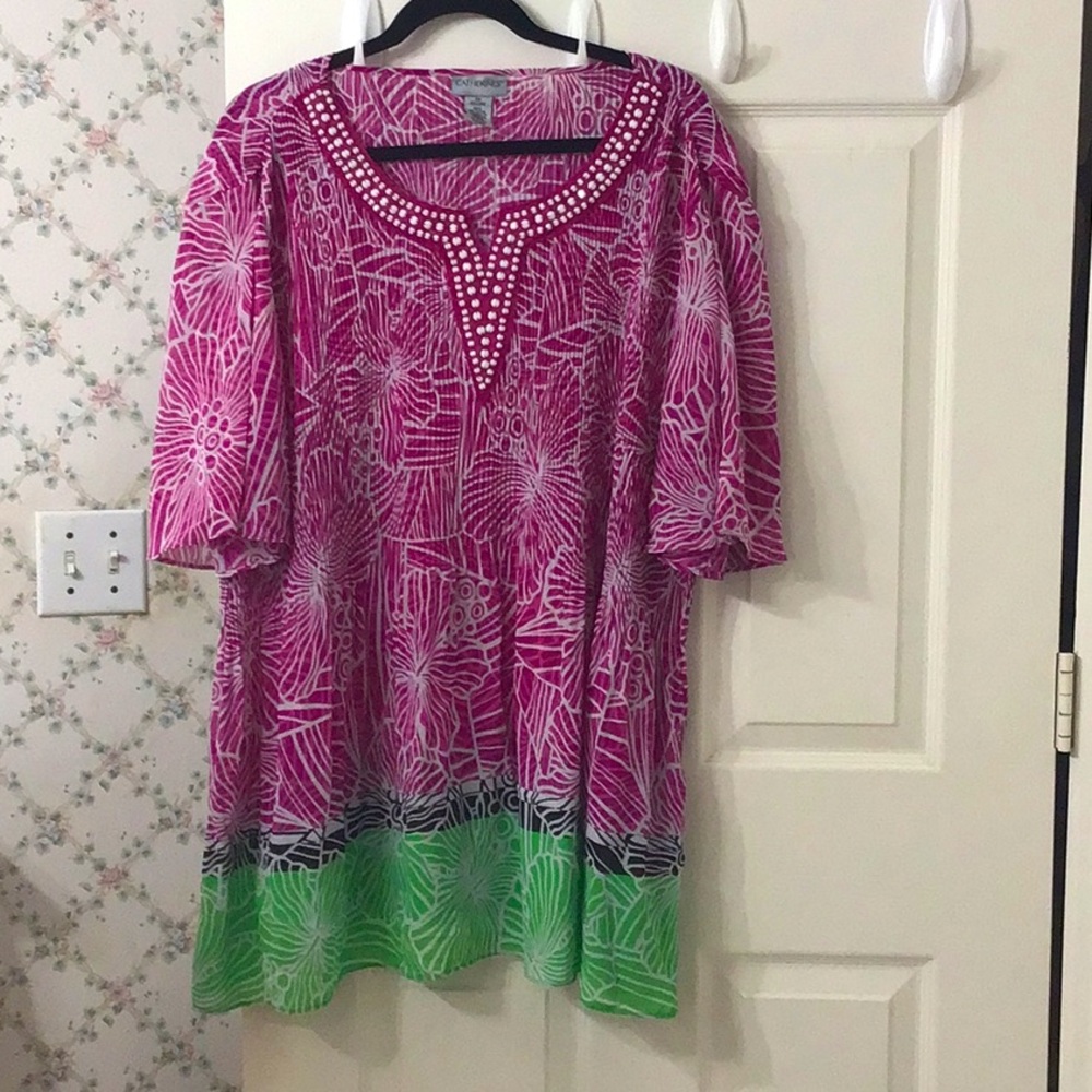 Plus size 2 X beaded V-neck boho style top. It is dressy casual. Flared sleeves.